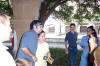 Chris poses for photos with fans outside the station. (August 1, 2003)